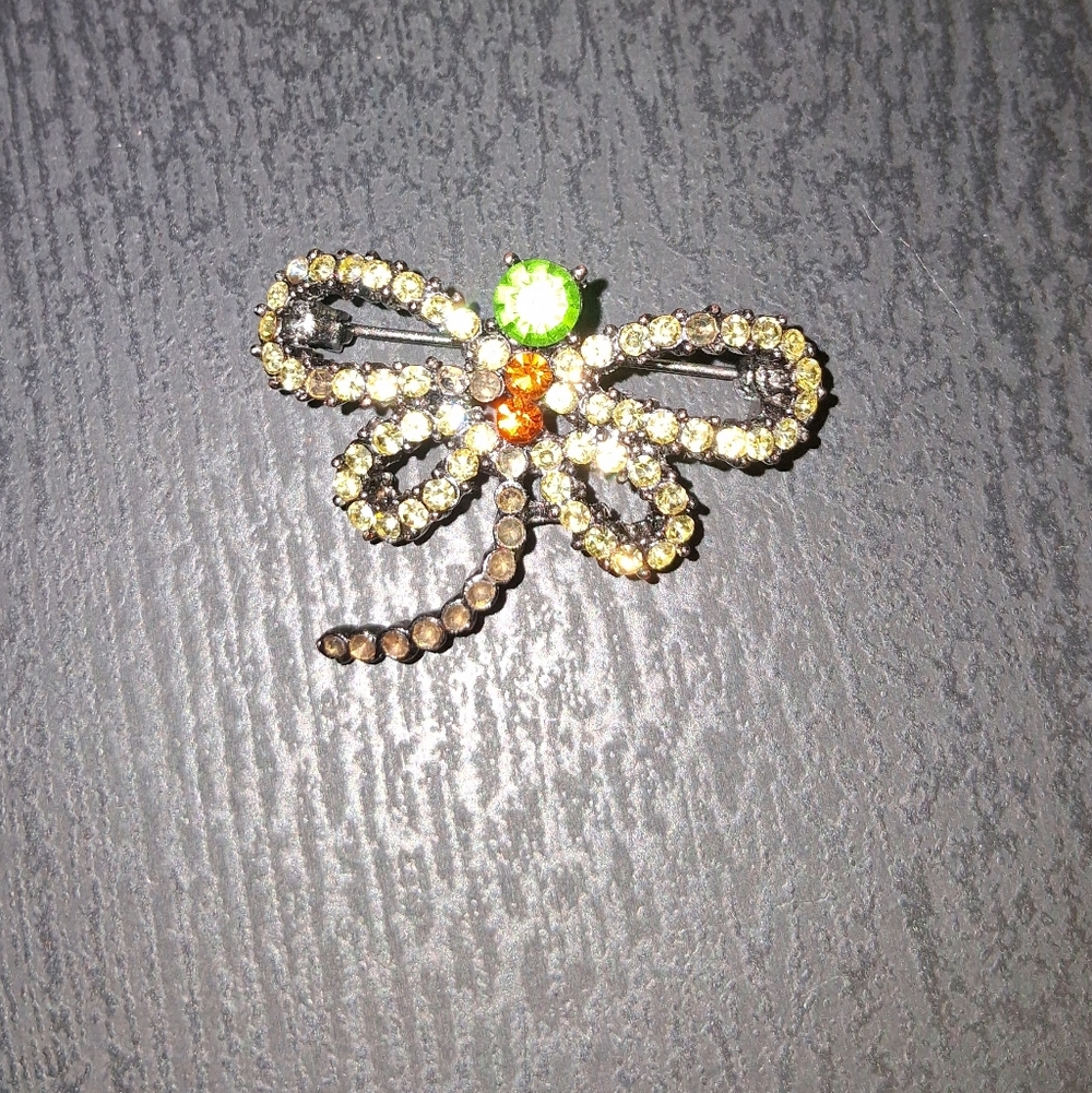 Elegant Dragonfly Brooch with Green and Orange Accents..